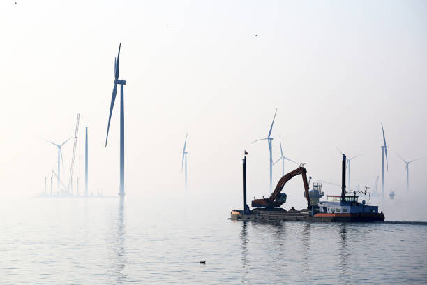 морские ветровые турбины - fog wind power energy fuel and power generation стоковые фото и изображения