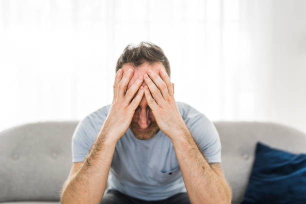 istock Thoughtful young man in the living room 1313880810