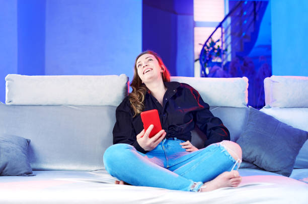 istock girl making plans for the future on the couch 1313881664