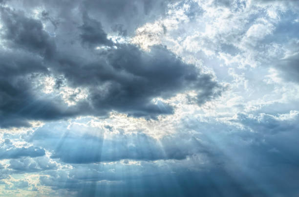istock Light of the setting sun through the clouds 1313881971