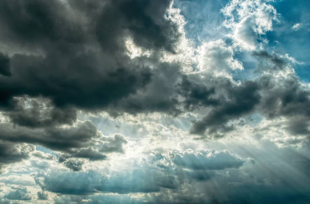 istock Light of the setting sun through the clouds 1313881984