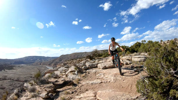 istock First person perspective of mountain biking desert pathway, over rocks 1313882416