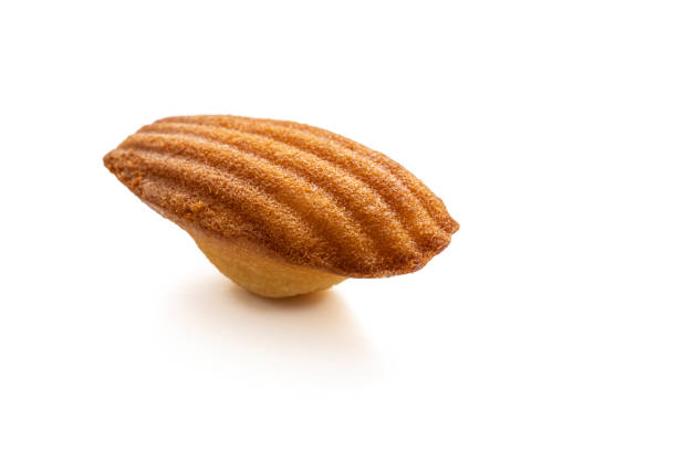 Madeleine french small sponge cake as a muffin with shell shape isolated on white