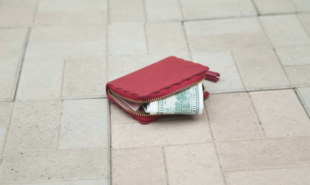 istock Red wallet on the floor, lost money concept. 1313883679