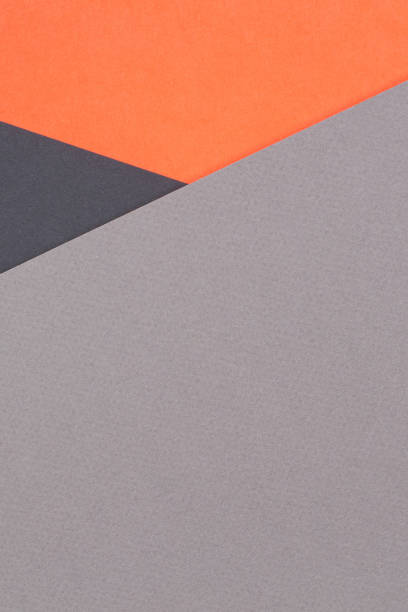 istock Creative abstract geometric colored paper background in orange, gray, black colors 1313889676