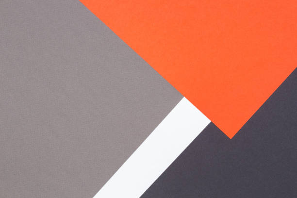 istock Creative abstract geometric paper background orange, white, light gray, black colors paper 1313889752