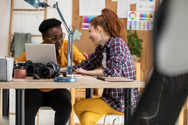 istock Two female coworkers having fun collaborating on a project together 1313897404