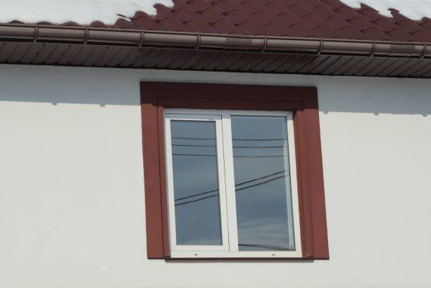 istock one white window on a gray concrete wall of a house 1313898129