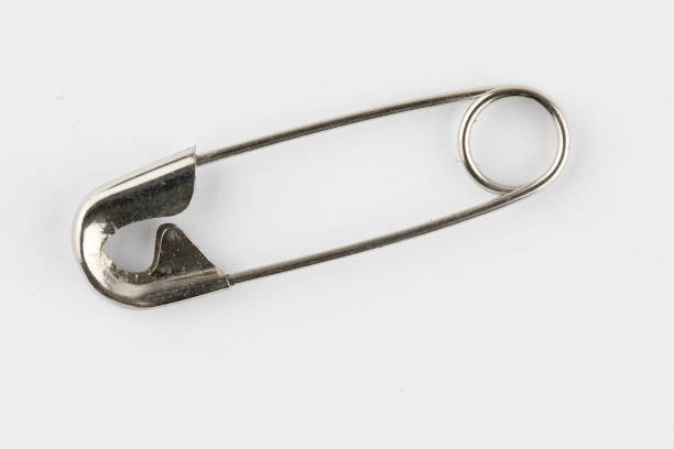 istock image of a single closed safety pin 1313899273