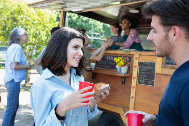 istock Young couple having some food outside 1313899447