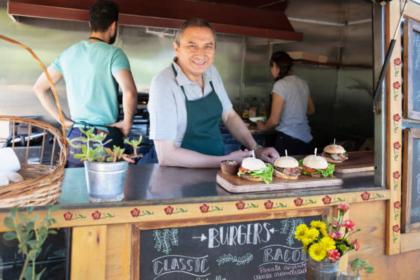 istock Senior man inside food truck 1313900005