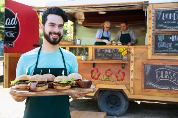 istock waiter serving food outside 1313900074