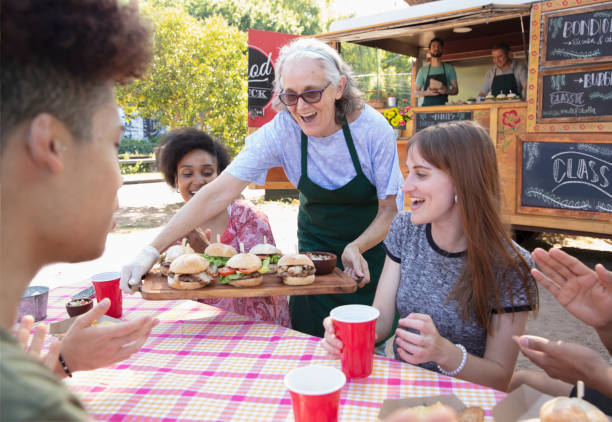 istock waitress serving food outside 1313900087