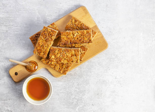 istock Almond florentines or Bee sting, thin shortbread covered cookies with honey 1313900578
