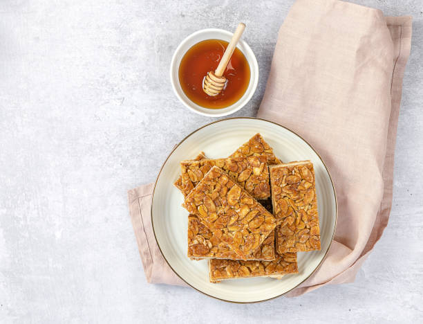 istock Almond florentines or Bee sting, thin shortbread covered cookies with honey 1313900726