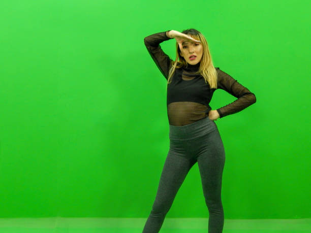 istock Woman exercising with green background 1313901843