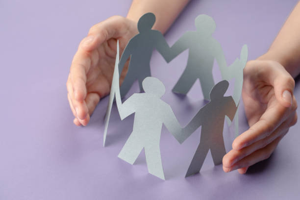 istock Hand Protecting Paper Cut Out Figure 1313901863