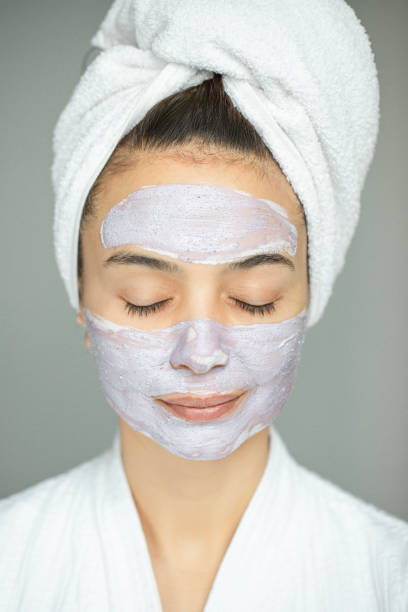istock Young Woman with Blueberry Mask 1313904041