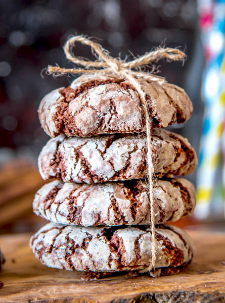 istock Chocolate crinkle cookies stacked and tied with string 1313906111
