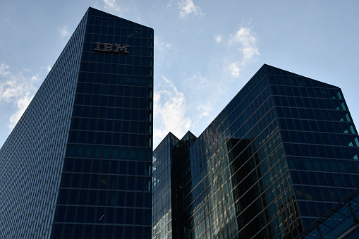 Munich, Germany - April 21, 2021: The top part of the Highlight Towers office buildings, designed by Murphy/Jahn, which are among the tallest buildings in the city, with the IBM sign visible.