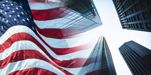 istock us flag wih downtown skyscrapers 1313913732