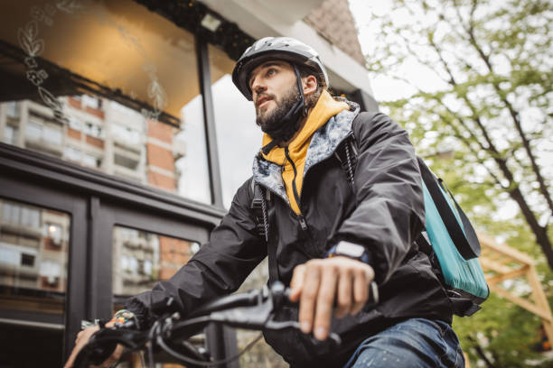 istock Delivery man picking up take away food order 1313914161