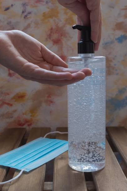 istock pouring alcohol-based hand sanitizing gel against coronavirus and other microvios 1313915139