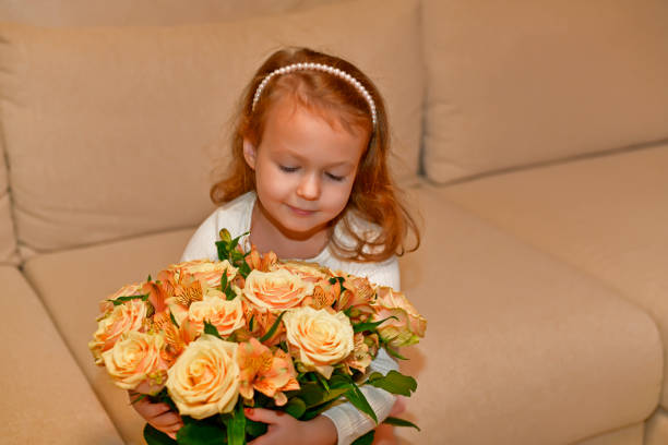 Mom and daughter with beautiful bouquets of flowers.
