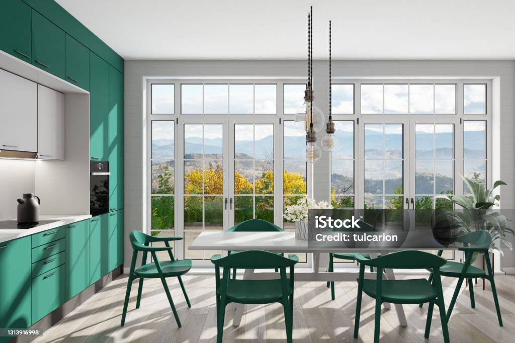 Emerald green Modern Scandinavian kitchen with large dining table and chairs. Large windows. Open space kitchen concept. Summer scene. Luxury Scandinavian apartment interior with modern minimalist kitchen and dining table.
Matte wooden cabinets. 
Floor is light matte hardwood. Open space style interior design. 3d rendering Kitchen Stock Photo
