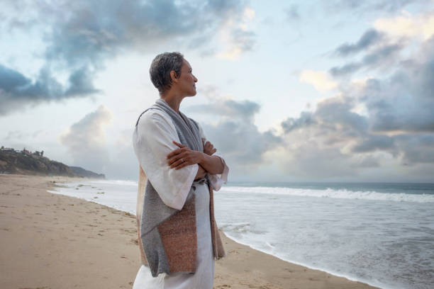 istock Peaceful Woman at the Beach 1313917526