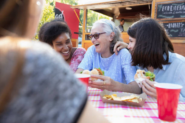 istock Friends having fun and eating outside 1313917714