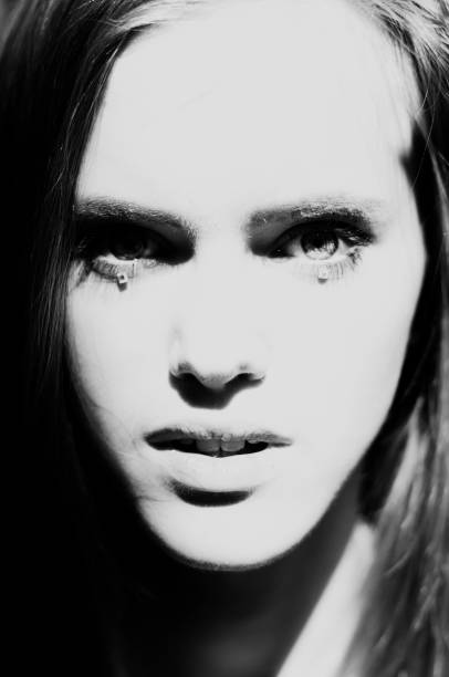 istock Young beautiful girl with glitter on the face 1313919421