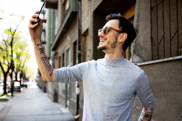 istock Handsome man taking a selfie on the street 1313919665