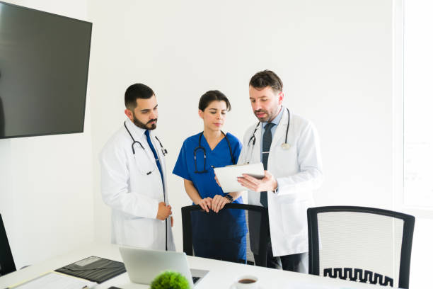 istock Hospital board working together on a medical case 1313919680