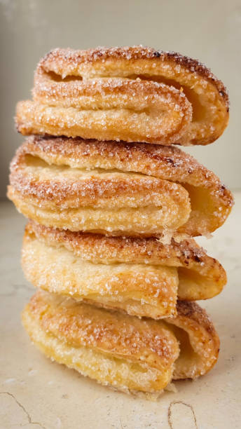 istock Column four sugar cookies on neutral background vertical orientation 1313919684