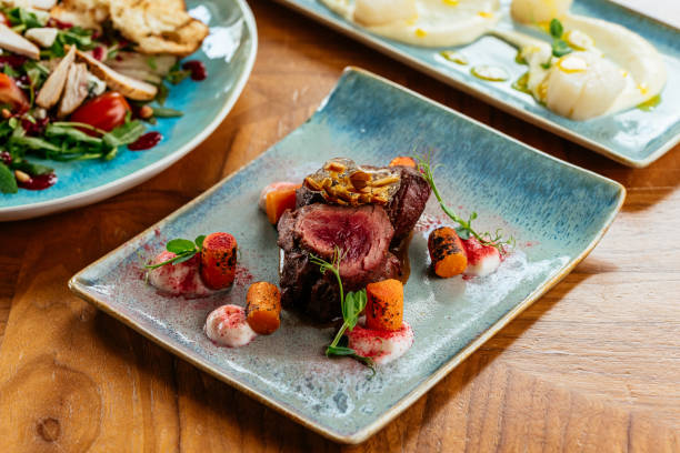 istock grilled steak with vegetables, sauce, herbs. 1313919877