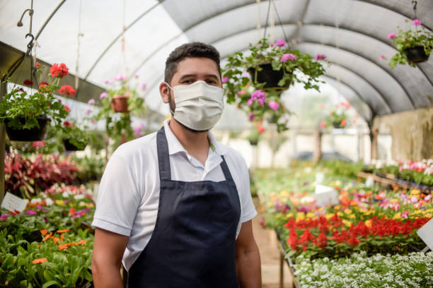 istock Florist wearing face mask. 1313924242