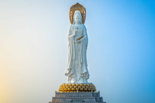 Beautiful front view of 108m high Guanyin of the South Sea statue of Nanshan Buddhism cultural park temple at sunrise in Sanya in Hainan island China Beautiful front view of 108m high Guanyin of the South Sea statue of Nanshan Buddhism cultural park temple at sunrise in Sanya in Hainan island China kannon bosatsu stock pictures, royalty-free photos & images