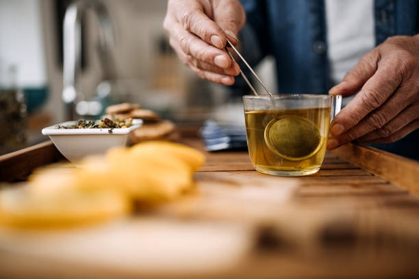 istock Unrecognisable senior man making cup of tea at home 1313927409