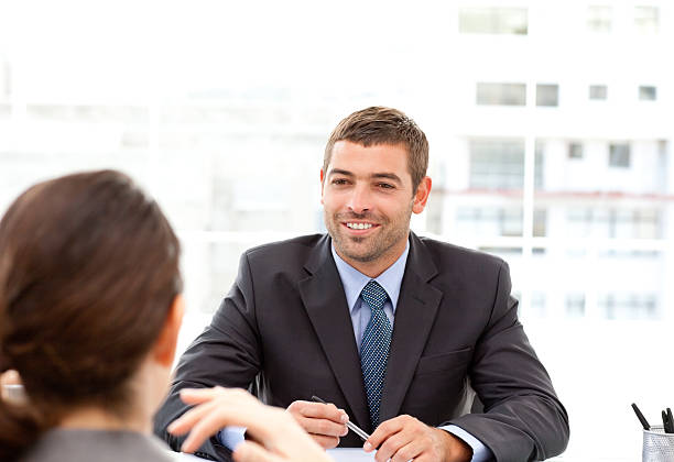 istock Two business people talking together during a meeting 131393106