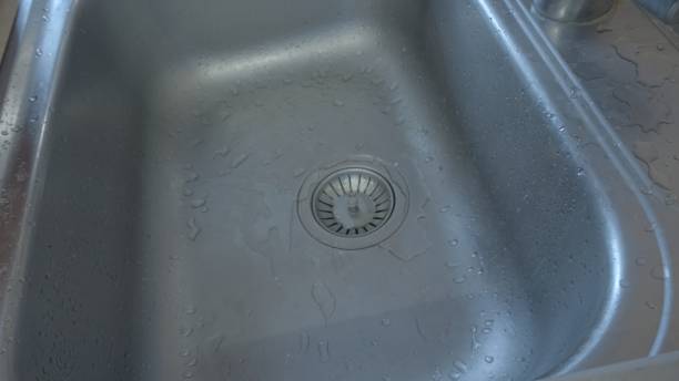 istock Metal sink in the kitchen top view. Close up shot 1313932237