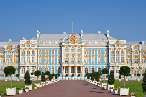 Main facade of the historic palace,  Baroque style. Blue, white and gold gamma. Summer sunny day.