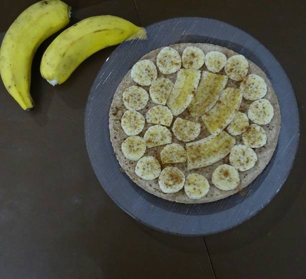 istock Brazilian dessert, banana pizza with cinnamon. 1313934023