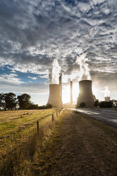 istock Smokestacks and cooling towers of coal fired power plants. 1313942034