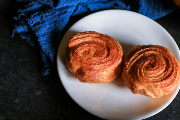 kouign amann and croissants with coffee for breakfast patisserie on dark background, french pastries. - baking traditional culture studio shot horizontal imagens e fotografias de stock