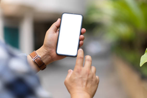 istock Over shoulder close up view of a man using smartphone include clipping path screen 1313950070