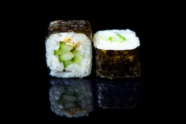 istock Traditional fresh japanese sushi rolls on a black background 1313951884