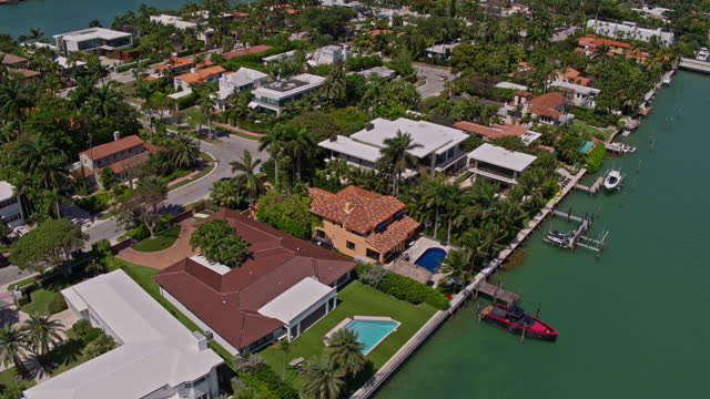 High-angle aerial view of residential houses on Venetian Islands, Miami, Florida. Drone-made video with panning camera motion.
