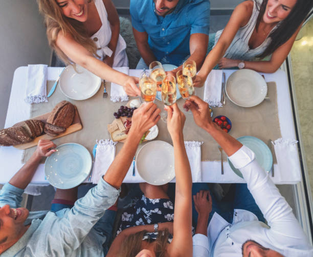 istock Group of toasting with champagne at a dinner party. 1313952941