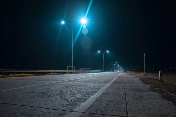istock night road with street lights 1313952965